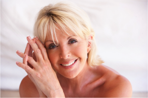 Mature woman with clear skin smiling
