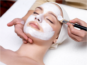 Woman receiving a face mask treatment