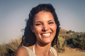 Woman outdoors smiling