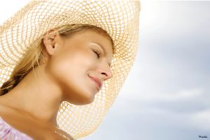 Woman wearing a sun hat outside
