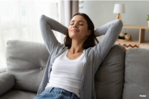 Woman relaxing on a couch indoors